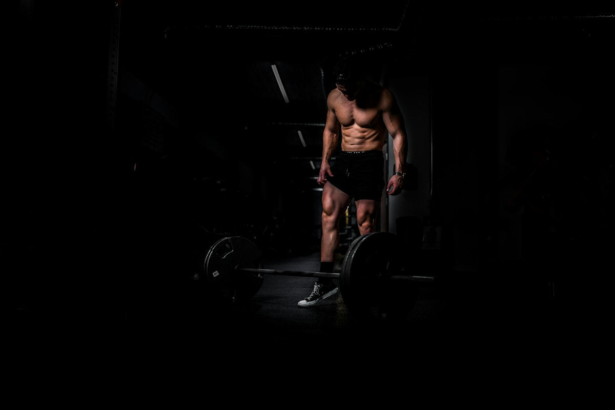 Man training with a barbell in the gym