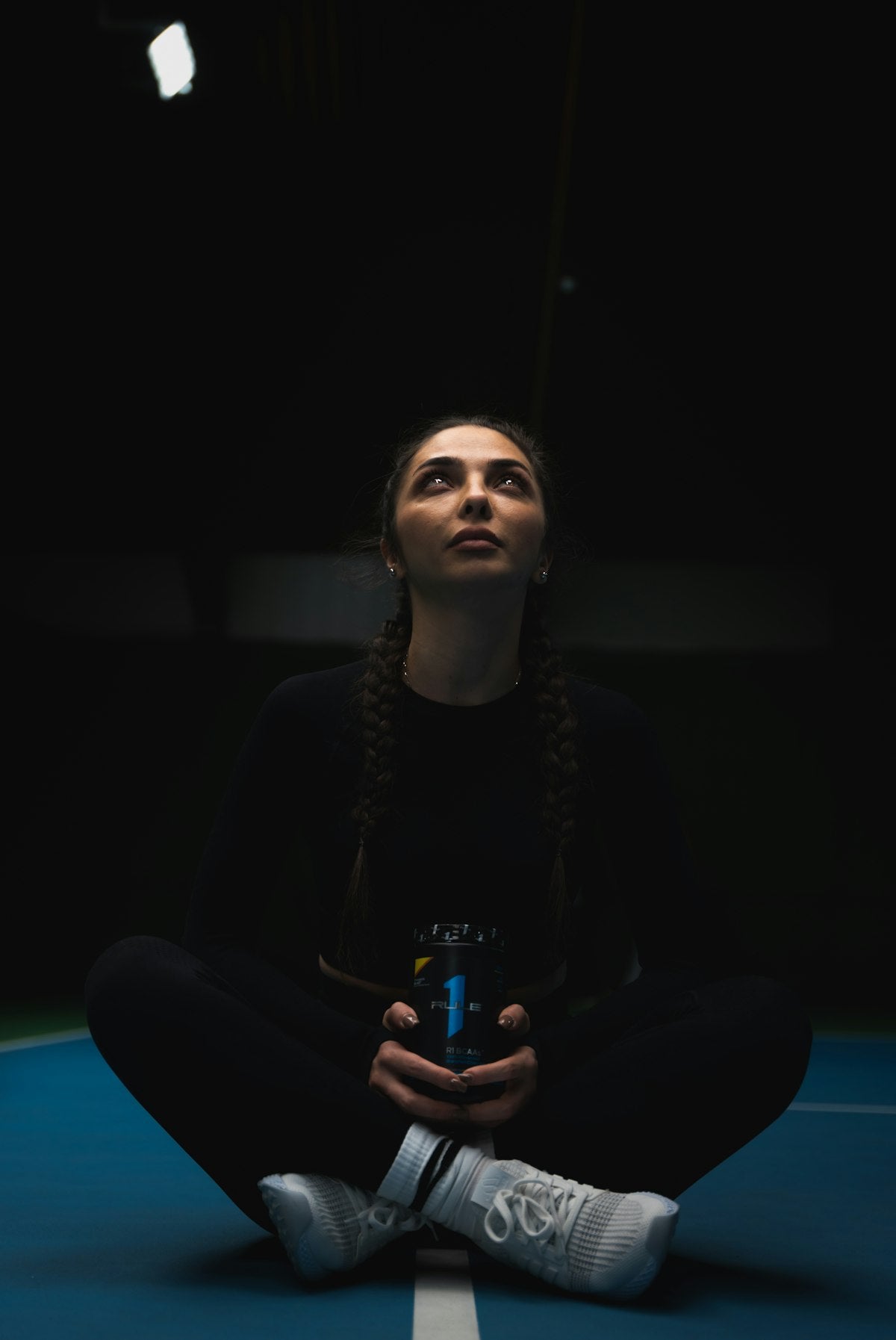 Woman taking a break during her daily workout routine